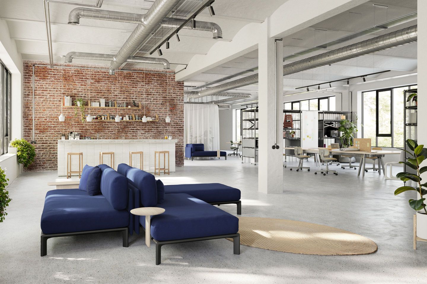 Großzügiger Büroraum mit modularem Sofa und Vitra Anagram Plattformverbinder, ideal für moderne Arbeitsumgebungen.
