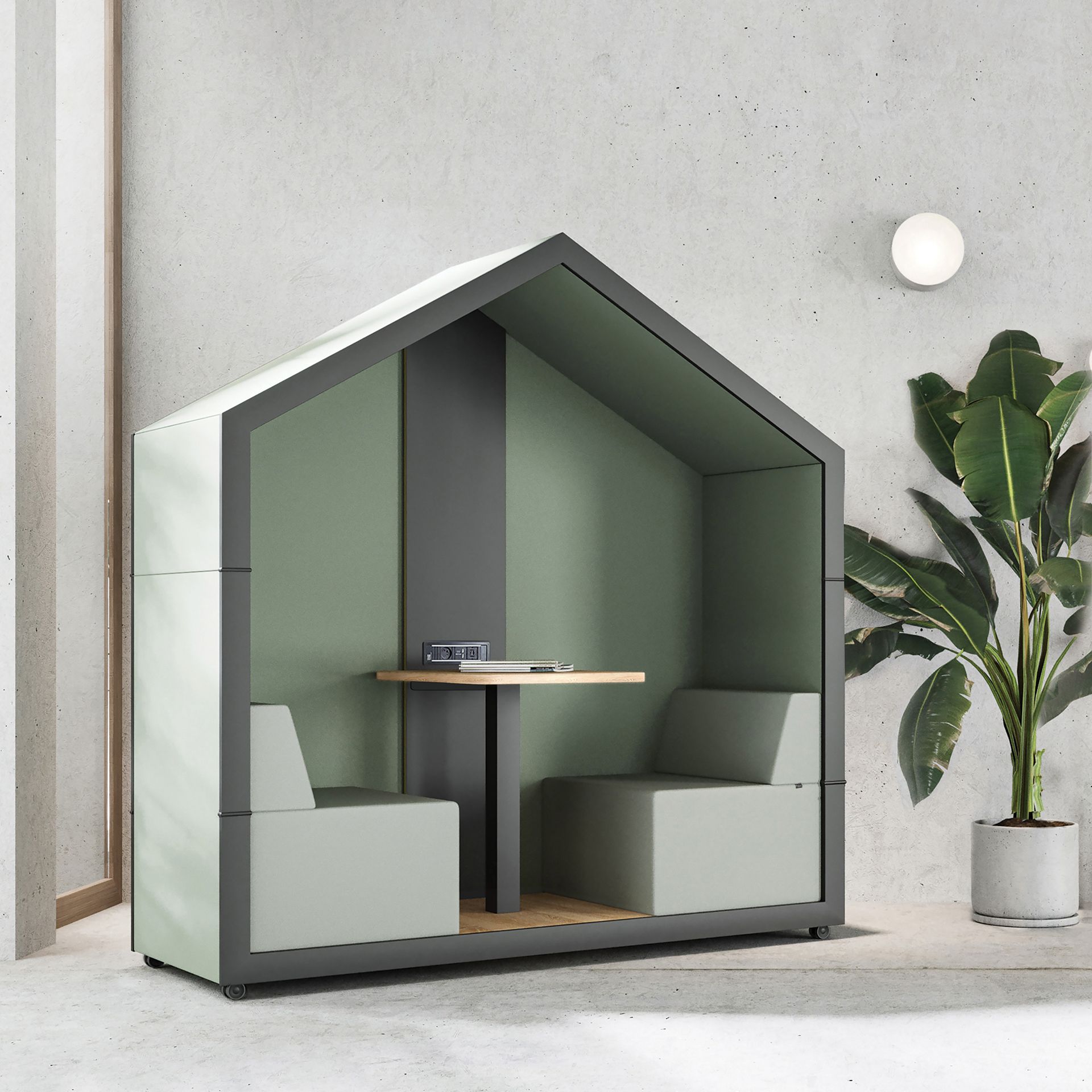 Bejot treehouse TH 2 Akustikkabine für zwei Personen mit Tisch und grüner Innenausstattung.