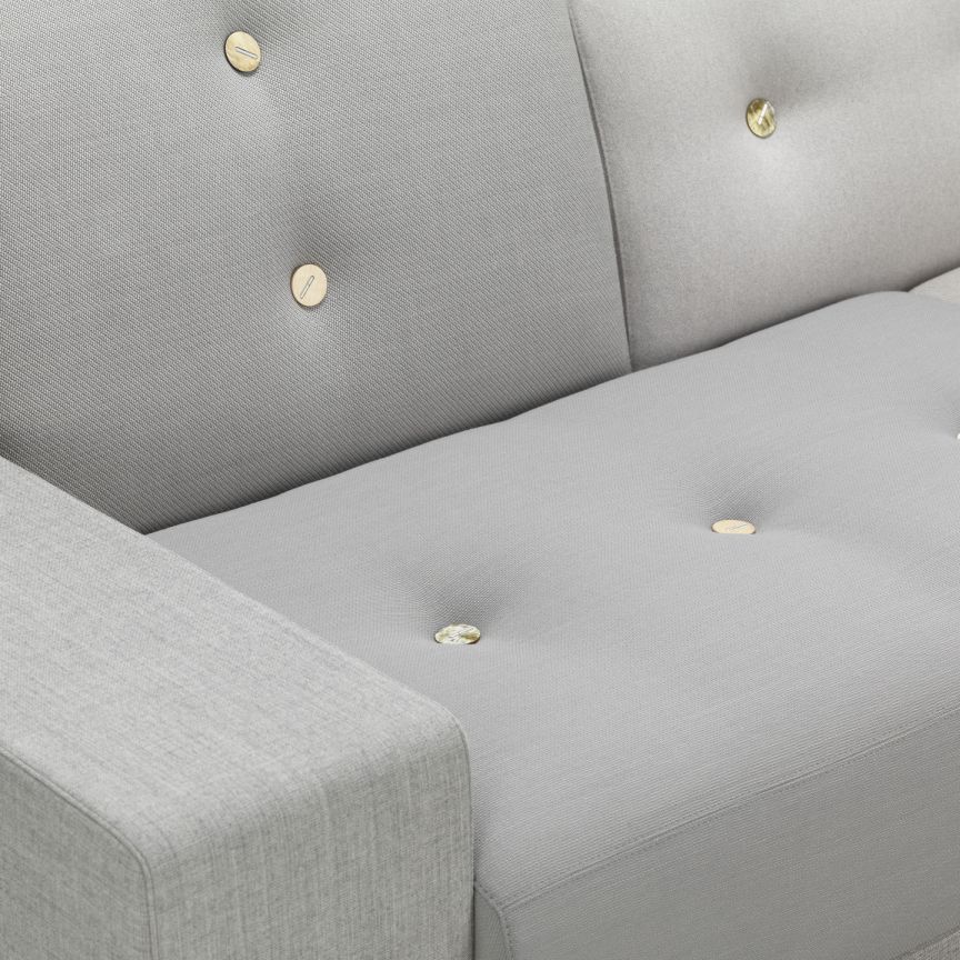 Detailaufnahme des grauen Vitra Polder Sofas mit Knopfheftung, modernes Design für Wohnzimmer und Lounges.