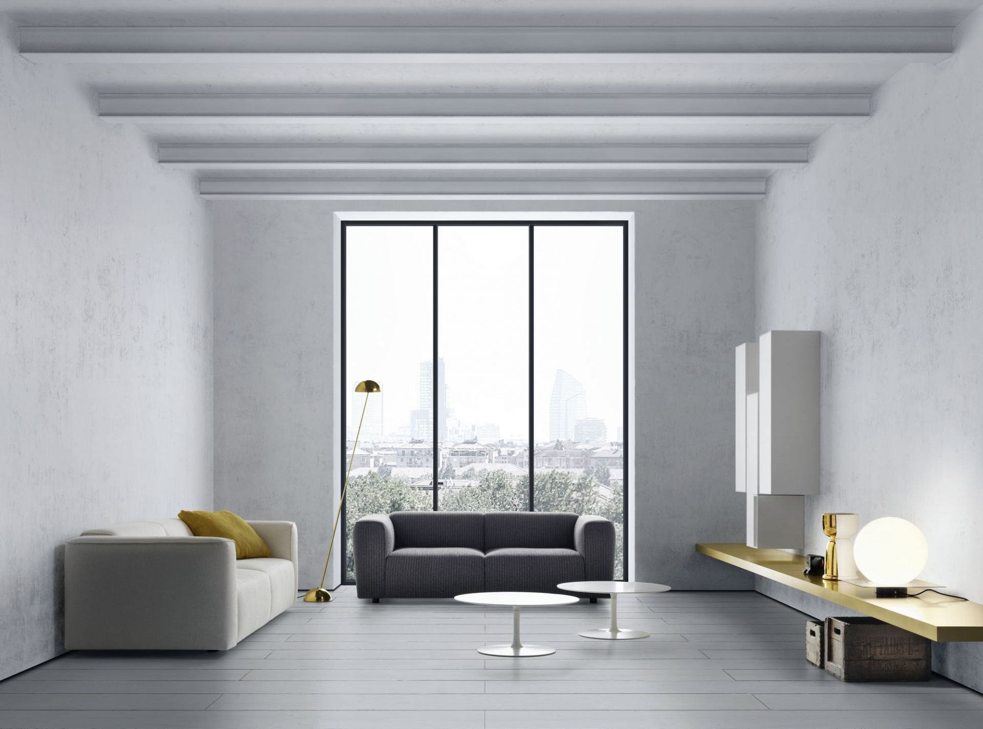 Heller Wohnraum mit Sofas und zwei weißen Flow Low Table Couchtischen von MDF Italia.