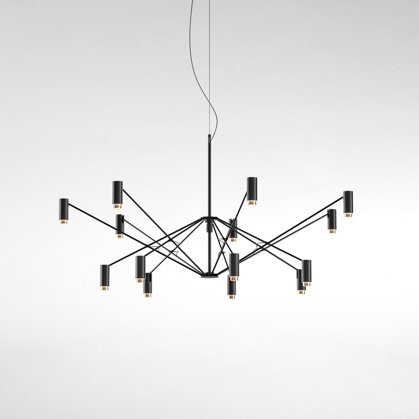The W Pendelleuchte von Marset, moderne Hängelampe in Schwarz mit zylindrischen Leuchten und warmem Licht.