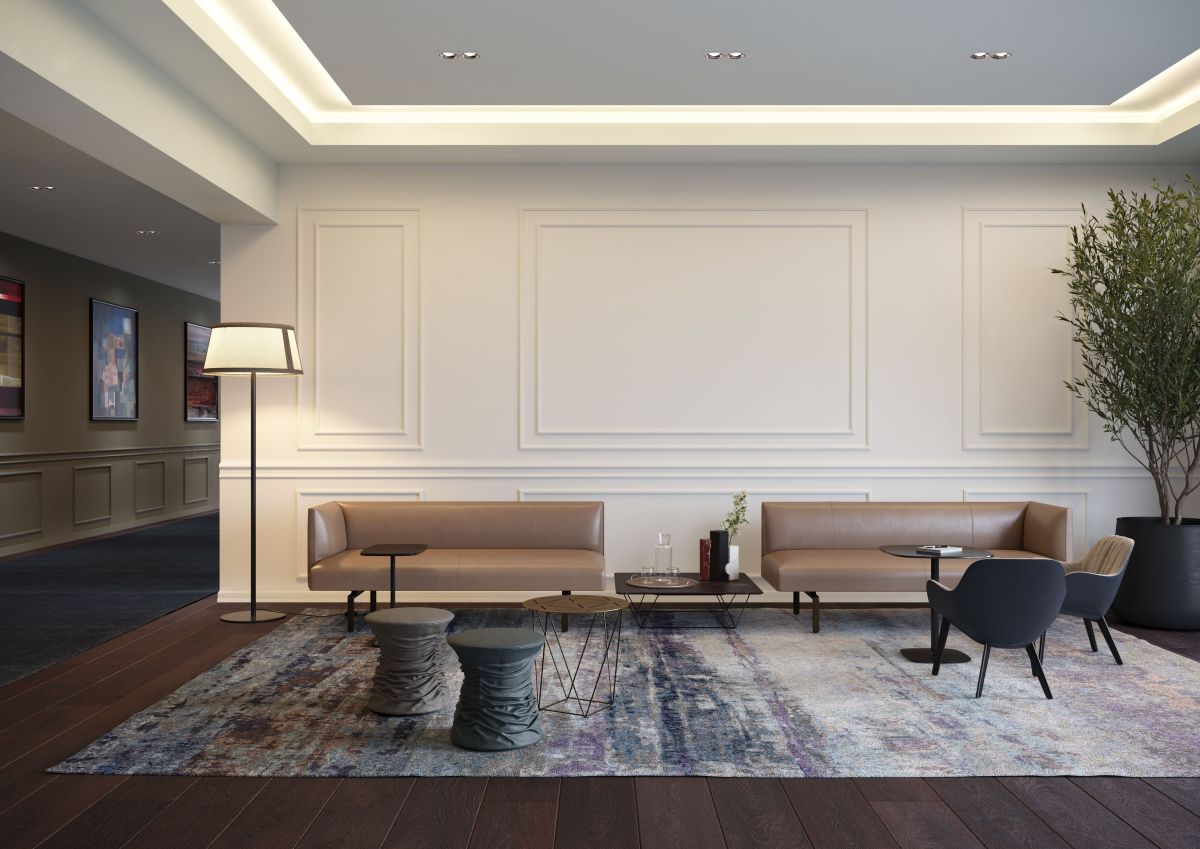 Wohnzimmer mit zwei Muud Lite Sofas von Walter Knoll in braunem Leder.