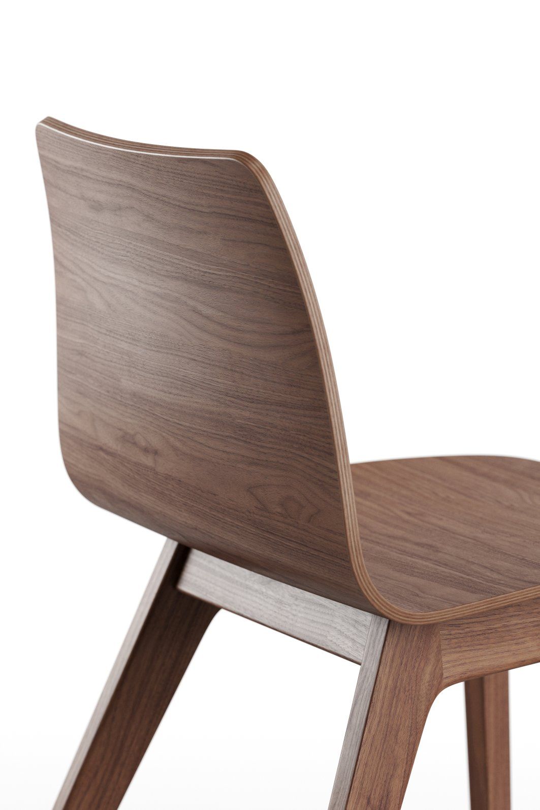 Detailansicht des Morph Plus Holzstuhls von Zeitraum, gefertigt aus edlem Nussbaumholz, modernes Möbeldesign.