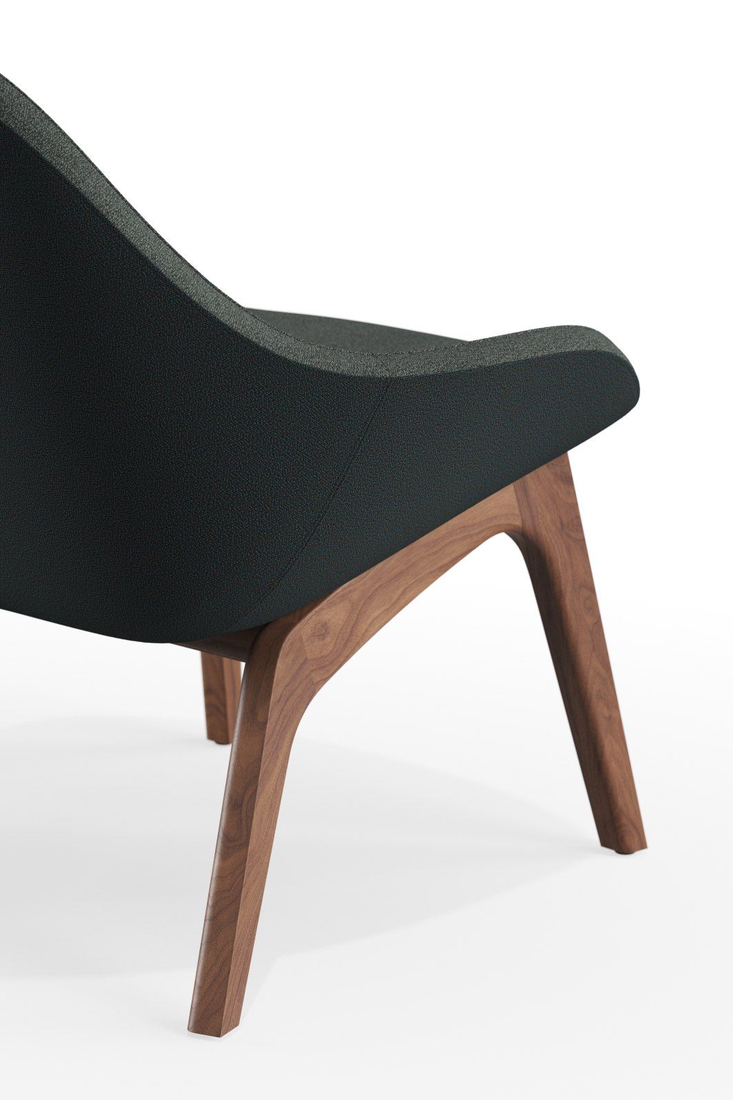 Detailaufnahme des Morph Lounge Chair Sessels mit dunklem Bezug und Holzbeinen.