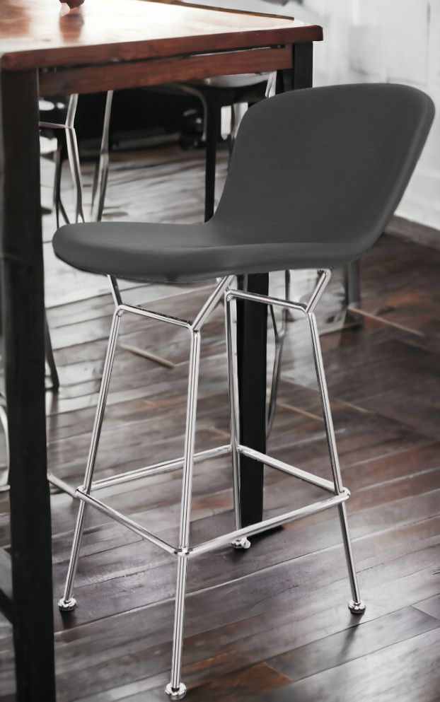 Bertoia Barhocker in Thekenhöhe mit schwarzem Kernlederbezug und verchromtem Stahlgestell von Knoll International.