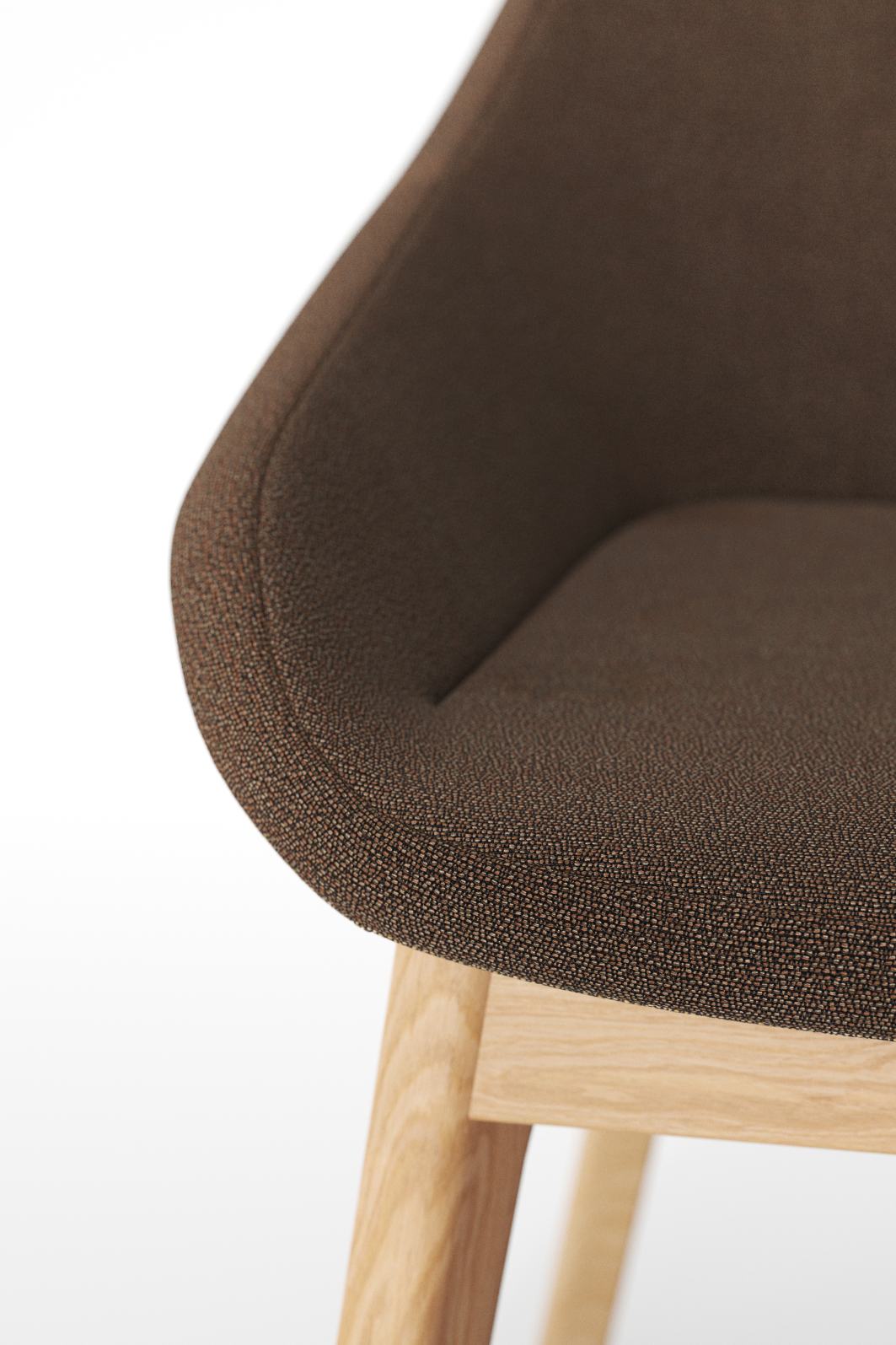 Detailaufnahme vom Morph Dining Chair Stuhl mit braunem Stoffbezug und hellem Holzgestell.