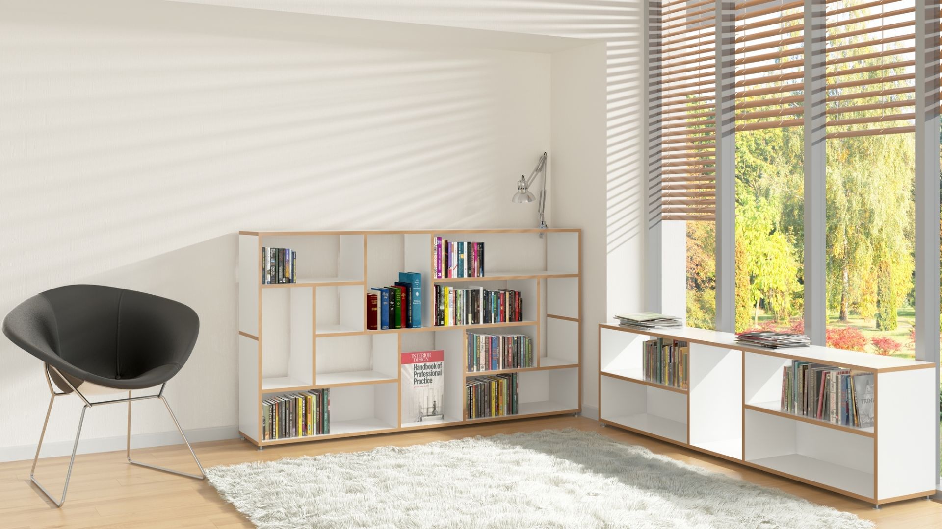 Modernes Wohnzimmer mit Tojo Sideboard, Bücherregal in Weiß und Holz, Sessel und Teppich.