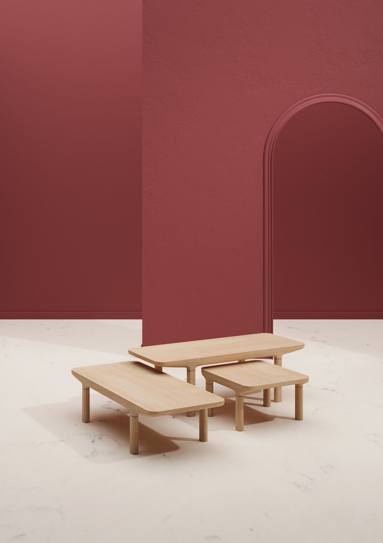 Camille Couchtisch aus hellem Holz vor roter Wand mit Türbogen, modernes Wohnzimmer Design.