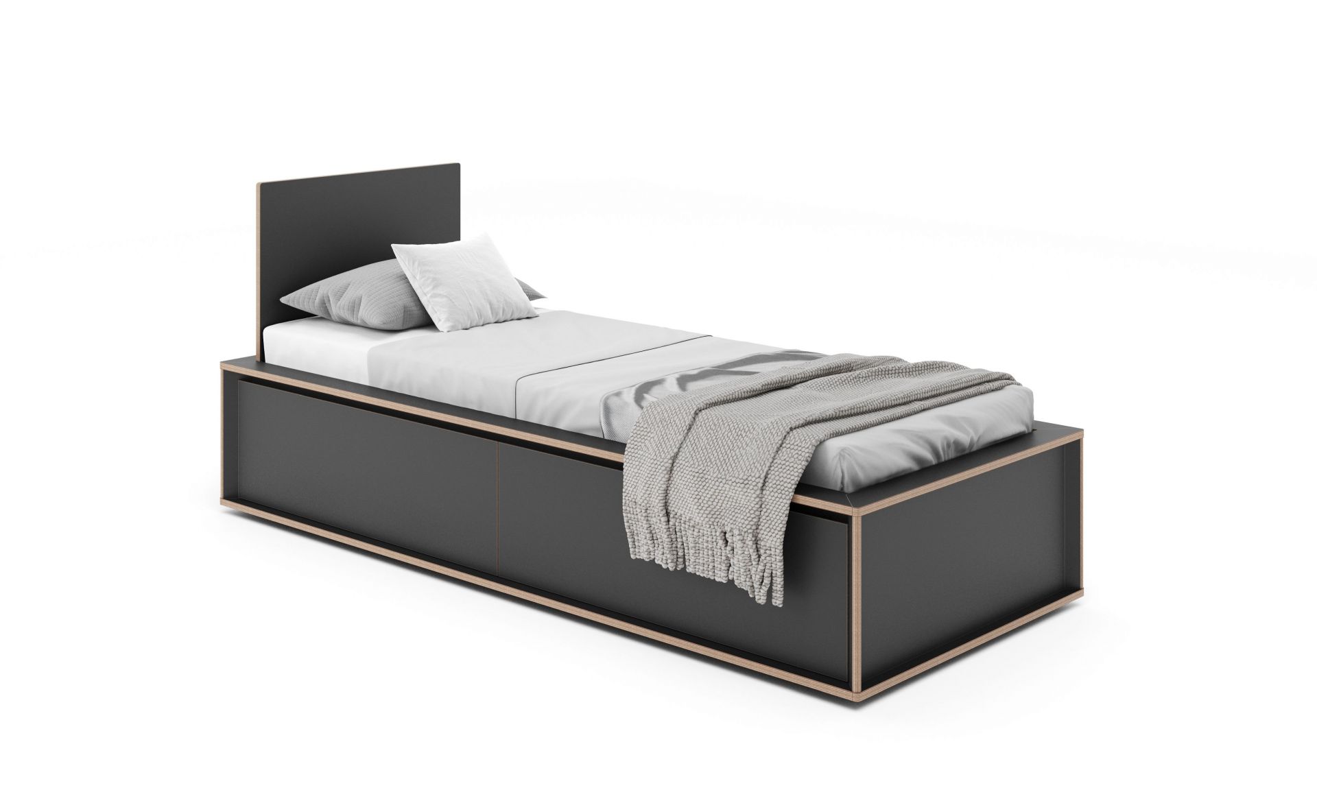 Spaze Bett von Müller Möbelwerkstätten in Schwarz mit Schubladen, Kissen und Decke.