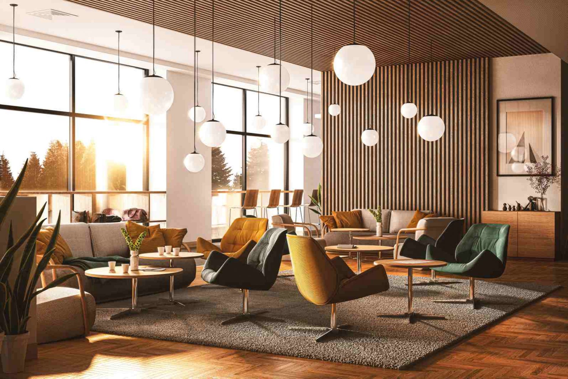 Innenaufnahme: Mehrere Thonet 809 Lounge-Sessel in Gelb, Grün und Schwarz mit passenden Tischen in einem Wartebereich.