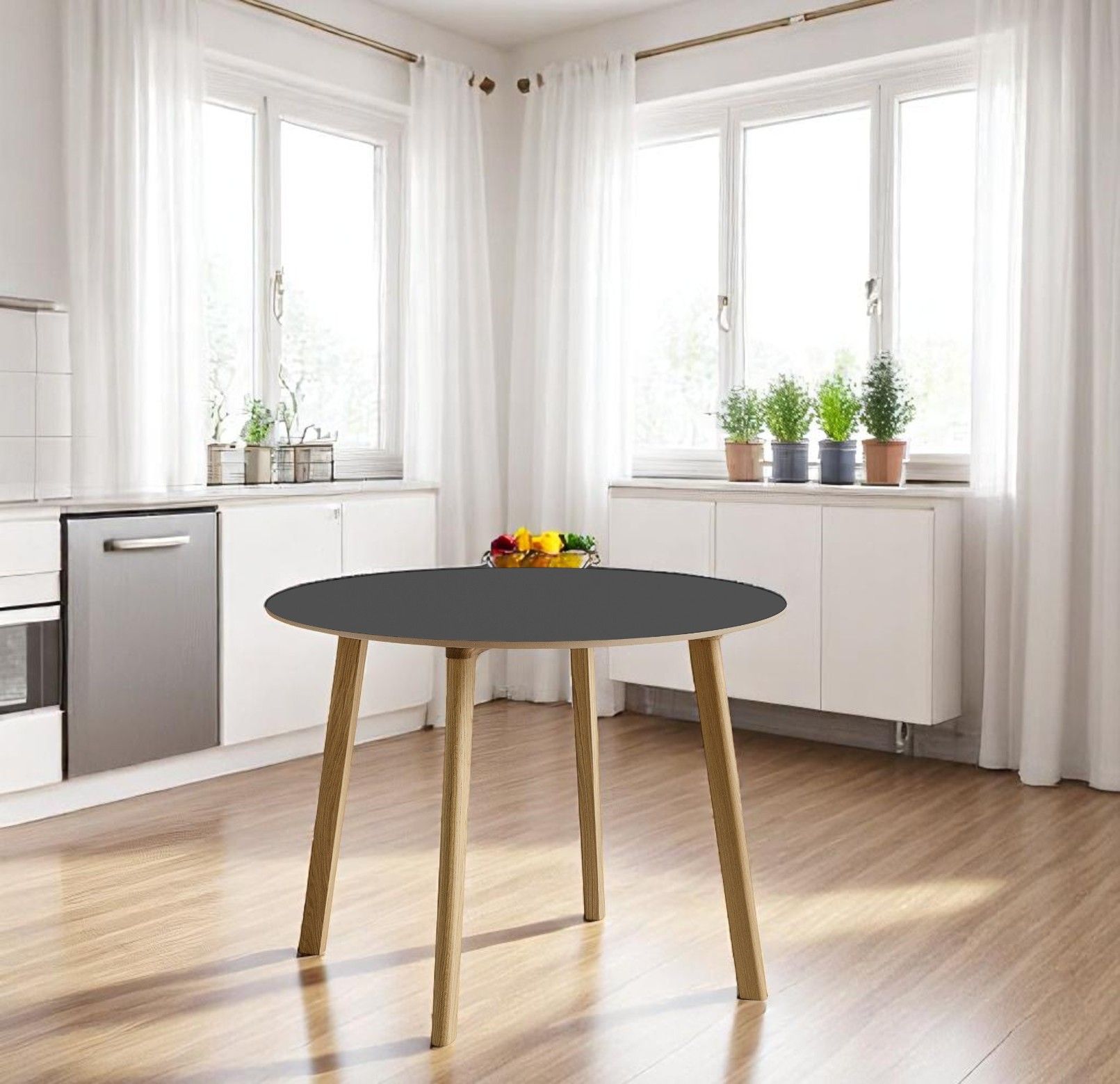 Hay CPH DEUX 220 Tisch mit runder, anthrazitfarbener Tischplatte und hellen Holzbeinen in moderner Küche.