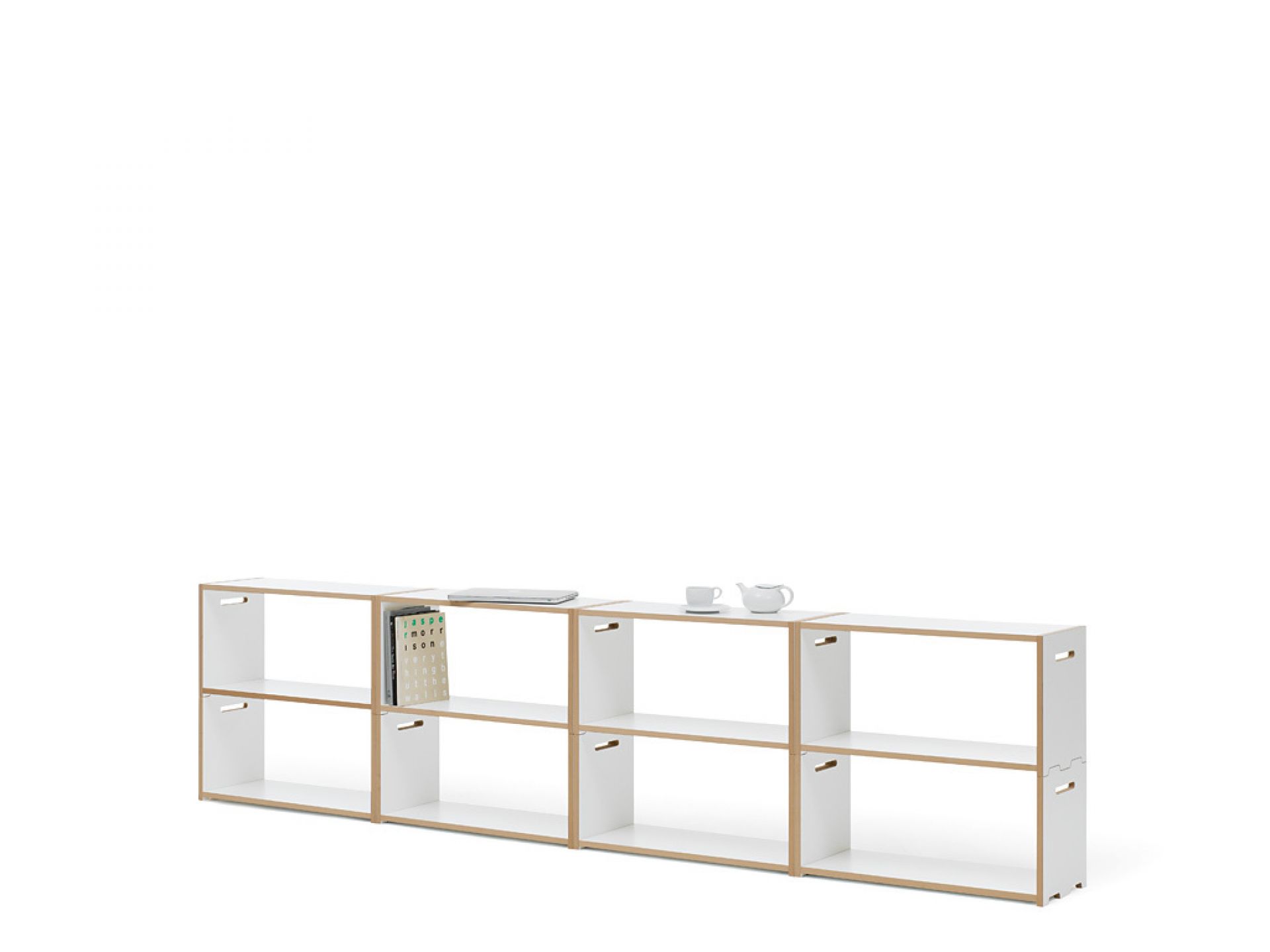 Tojo Hochstapler Regal Grundmodul, weißes modulares Regalsystem mit Fächern, Bücher, Laptop und Teegeschirr.