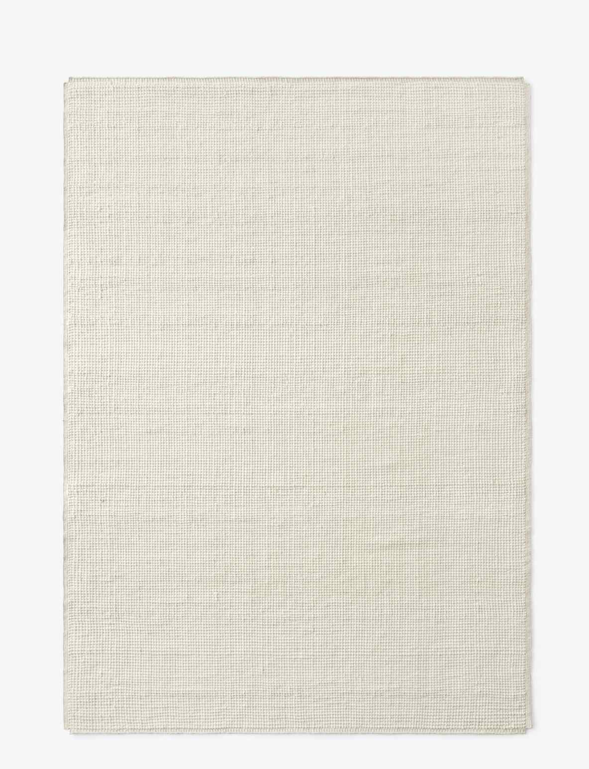 AndTradition Collect Rug SC84/SC85, einfarbiger, rechteckiger Teppich in Beige mit feiner Webstruktur.