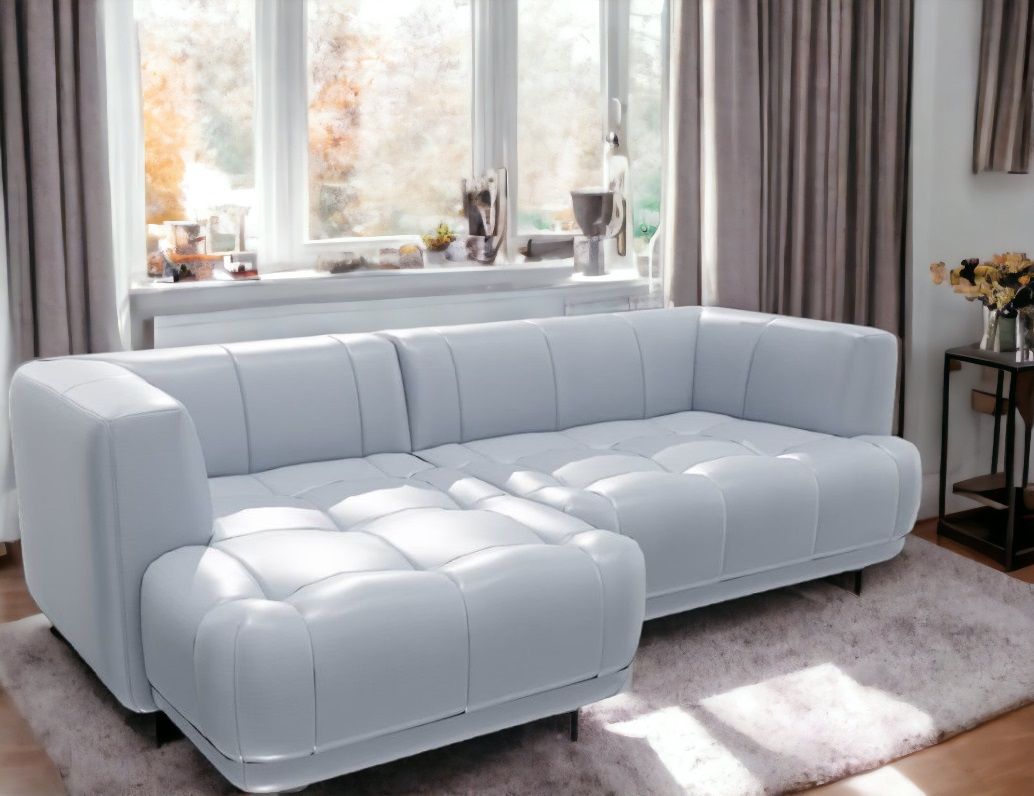Helles Quilton Sofa von Hay, ein modernes Ecksofa mit gesteppten Polstern und minimalistischem Design.