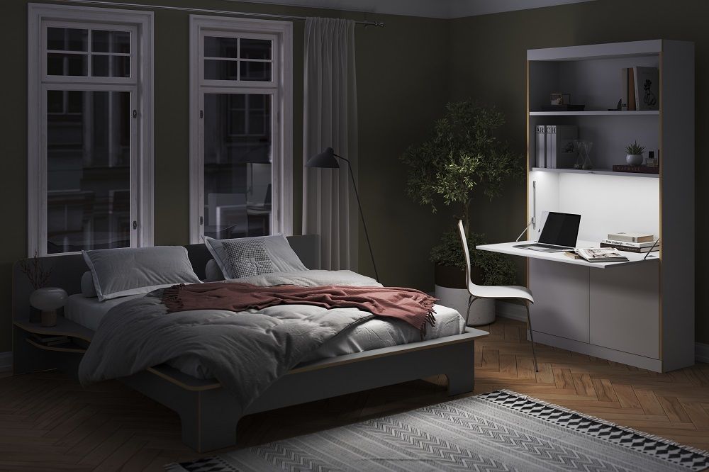 FLAI Home-Office Sekretär von Müller Möbelwerkstätten im Schlafzimmer mit Bett, Schreibtisch und Regal.