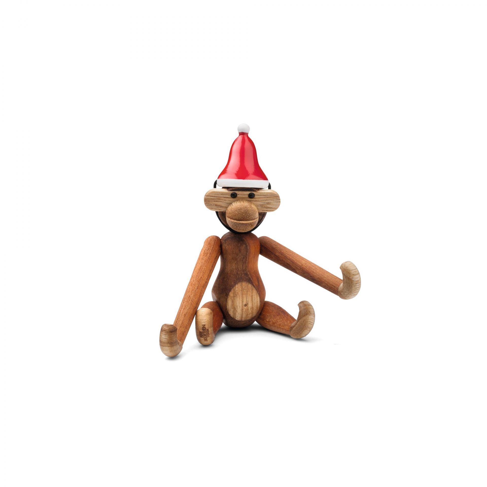 Mini Kay Bojesen Affe aus Holz mit roter Weihnachtsmütze, sitzend auf weißem Hintergrund.