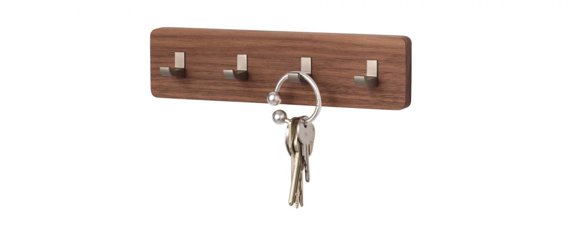 Schönbuch Key Bar Schlüsselbrett aus Nussbaumholz mit vier Haken und Schlüsselbund.