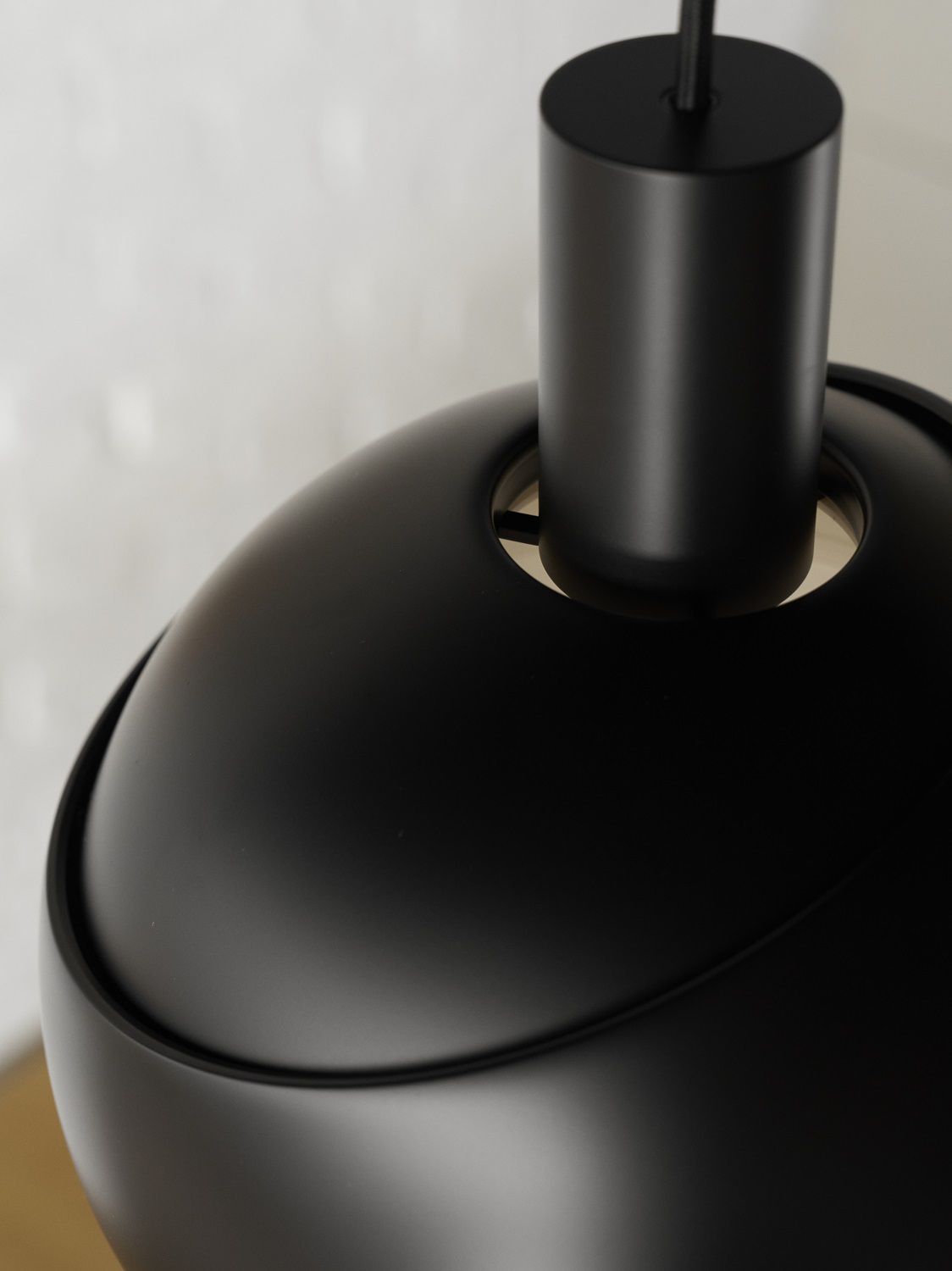 Detailaufnahme der FJ Elements Pendelleuchte von Louis Poulsen in Schwarz, modernes Design für stilvolle Innenräume.