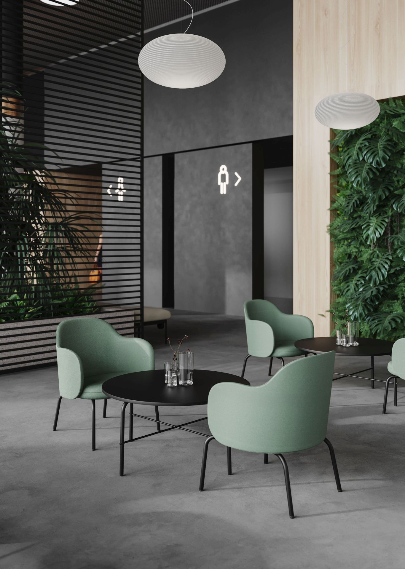 Innenaufnahme: Moderne grüne Loungesessel von Bejot, Modell FS F 420, mit schwarzen Tischen in stilvollem Wartebereich.