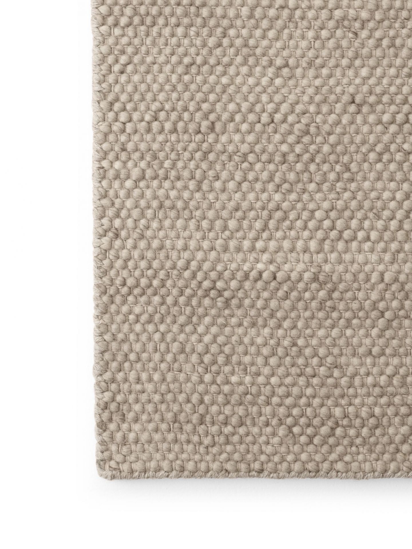 Detailaufnahme Vipp Wollteppich, handgewebt, beige, hochwertige Textur, Teppich für Wohnzimmer und Schlafzimmer.