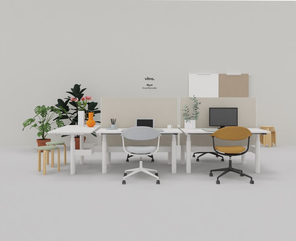 Vitra Mynt Bürodrehstühle aus Schichtholz in Grau und Gelb an weißen Schreibtischen im Büro.