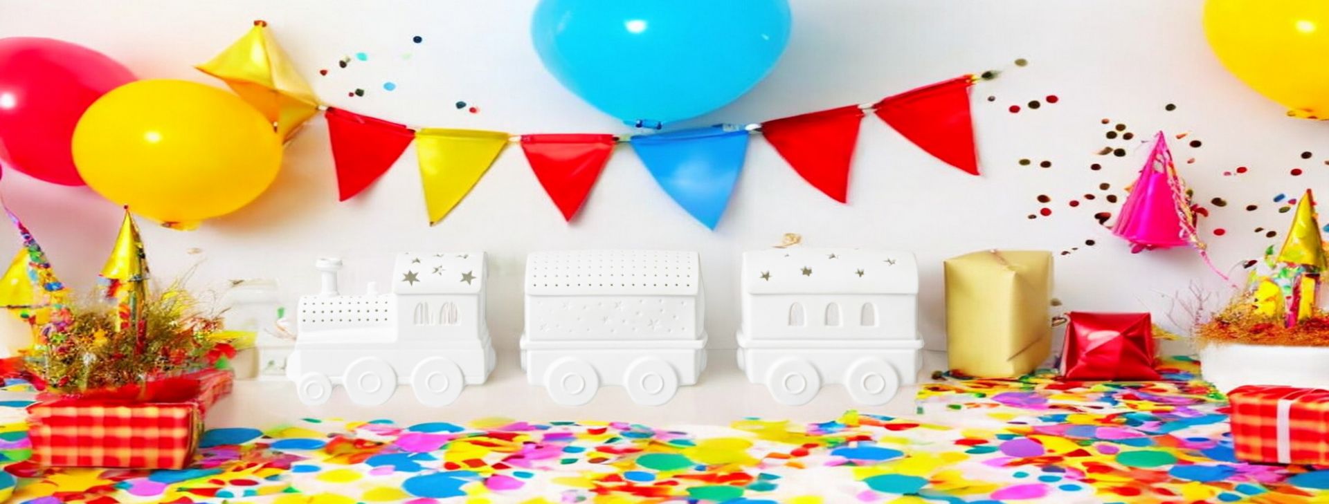 LED Lichtzug Set Räder auf festlicher Dekoration mit Ballons, Girlande, Konfetti und Geschenken.