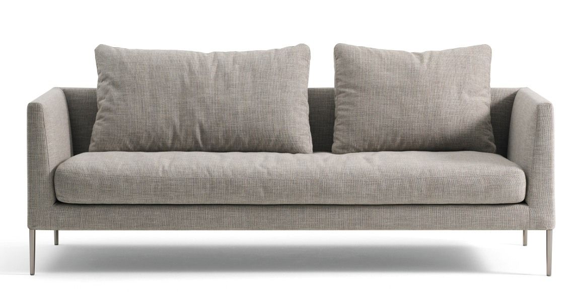 Helles Cor Pilotis Sofa ohne Rückenkissen mit zwei losen Kissen und Metallfüßen.