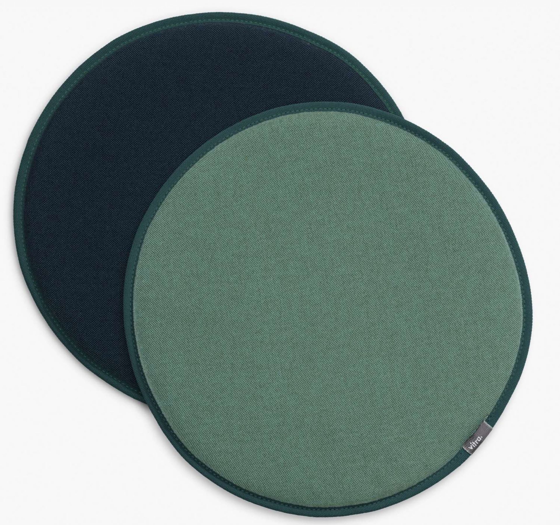 Vitra Seat Dot Sitzkissen in Grün- und Blautönen, runde Polsterauflage für Stühle.