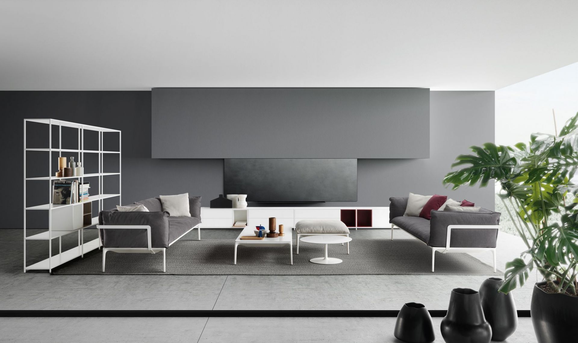 Heller Wohnraum mit grauem Sofa und weißem Flow Low Table Couchtisch von MDF Italia.