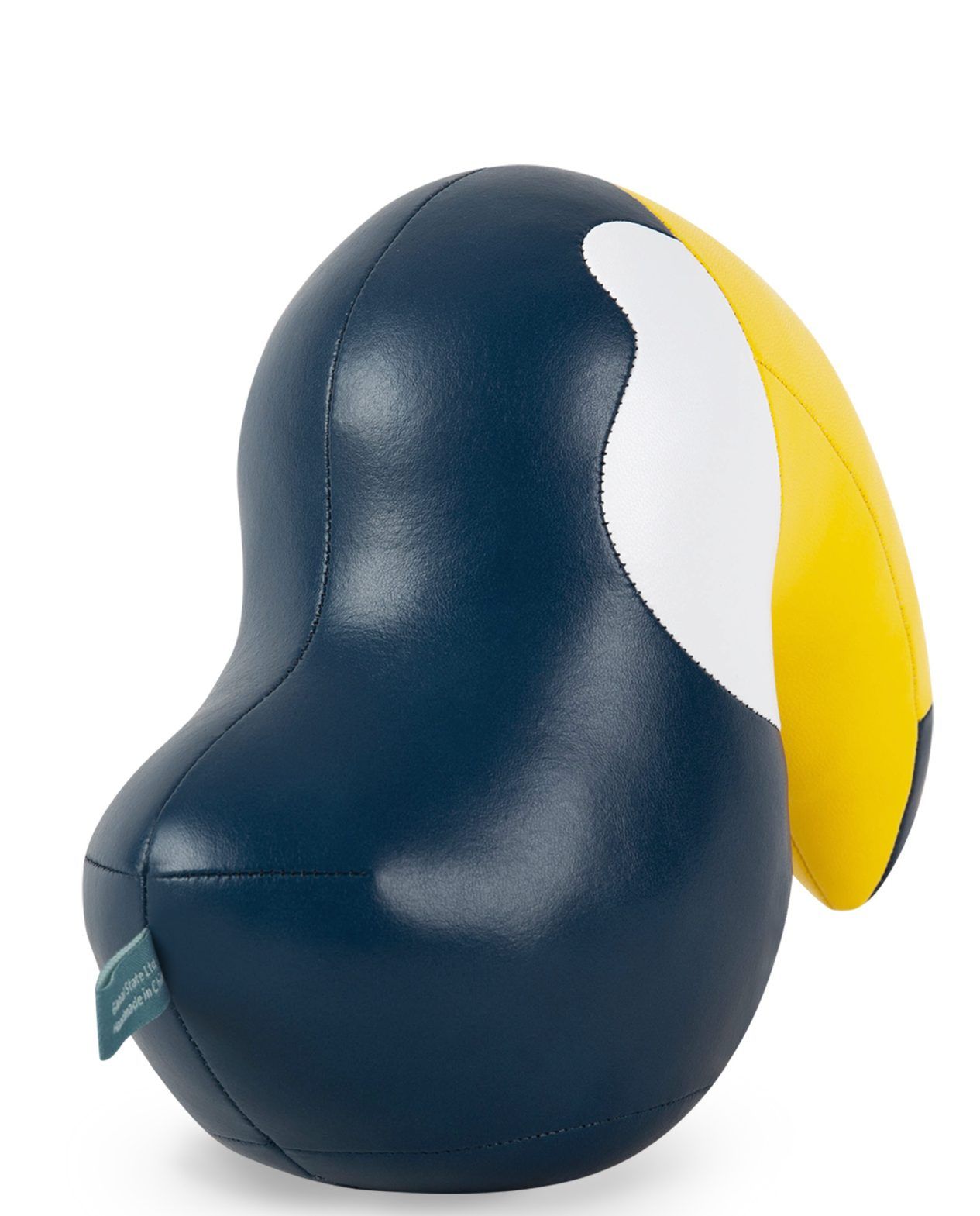 Detailaufnahme der Züny Toucan Buchstütze in Mitternachtsblau und Gelb, dekoratives Wohnaccessoire.