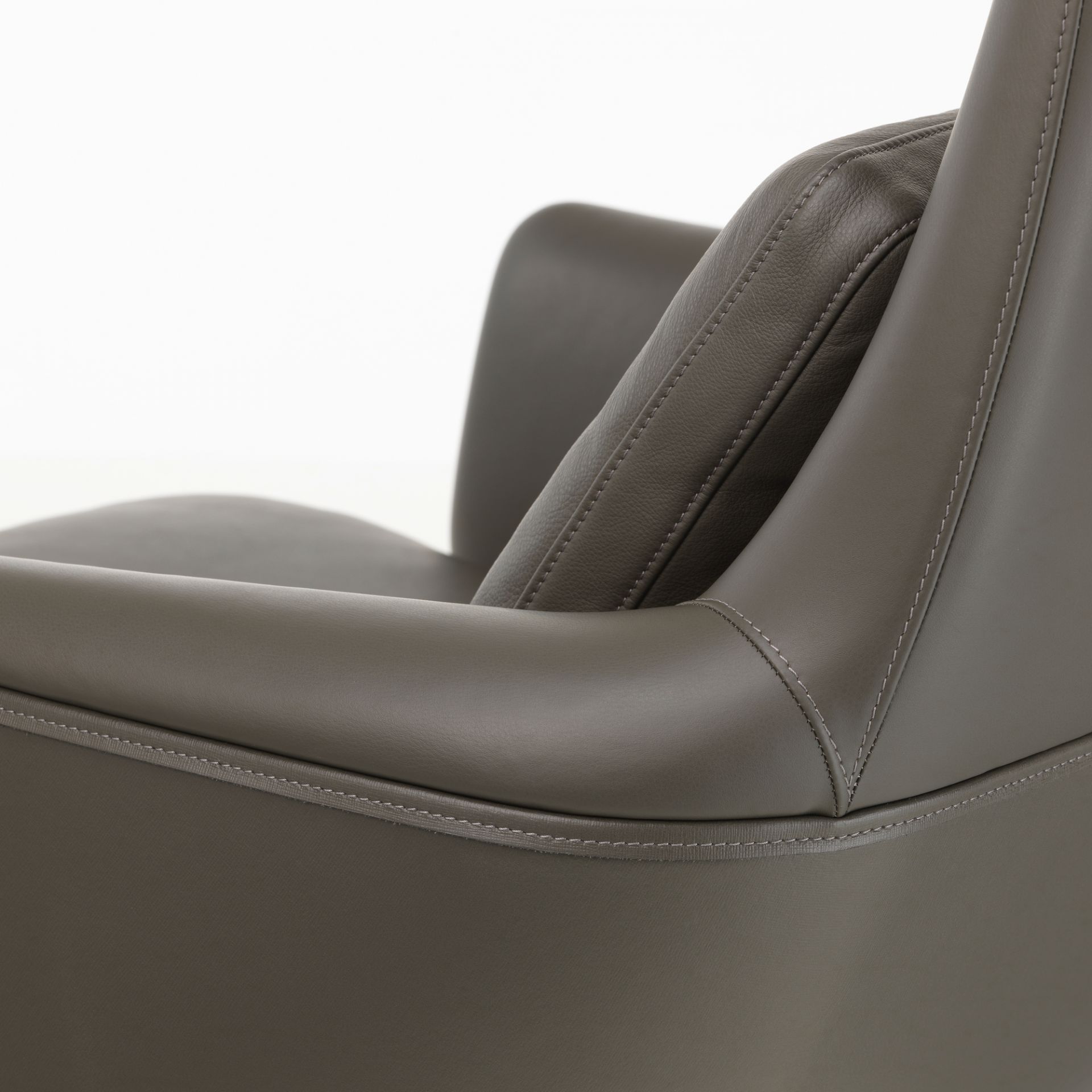 Detailaufnahme des Vitra Grand Relax Sessels in grauem Leder, hochwertige Wohnzimmermöbel.
