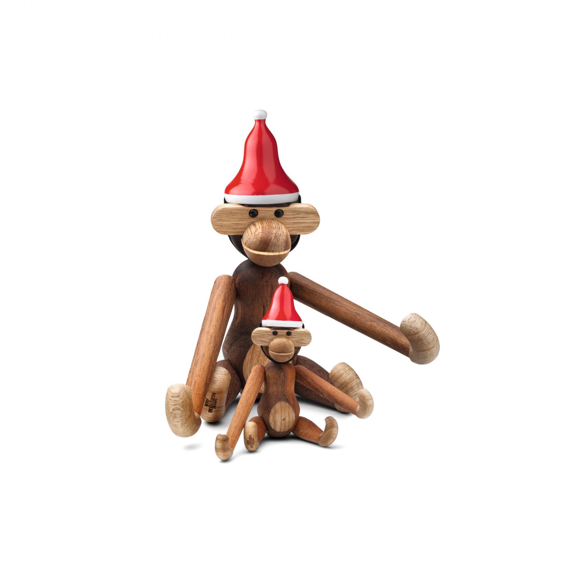 Kay Bojesen Affe Mini mit Weihnachtsmütze, zwei Holzaffen sitzen nebeneinander, festliche Weihnachtsdekoration.