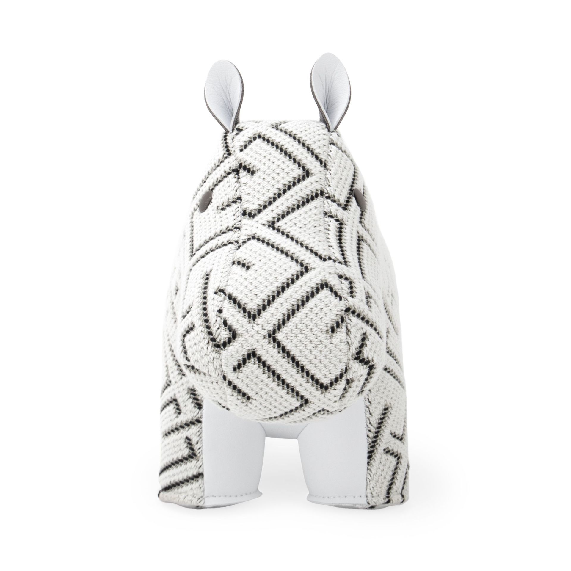 Weiße Hippo Buchstütze mit geometrischem Muster, Stoffbezug und Lederakzenten, Zuny x KVADRAT Design.