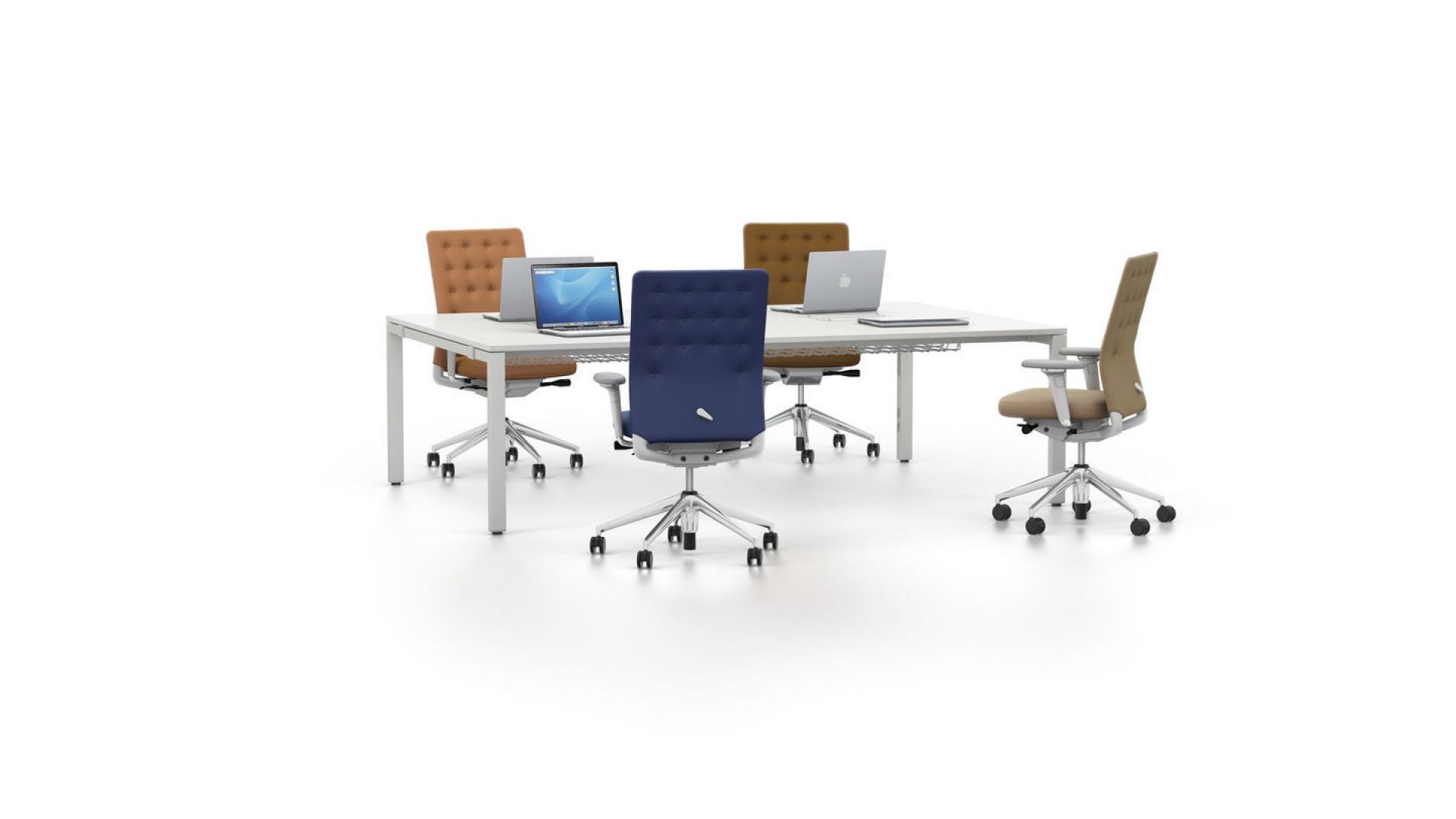 ID Trim Bürodrehstuhl von Vitra in verschiedenen Farben um einen weißen Konferenztisch mit Laptops.