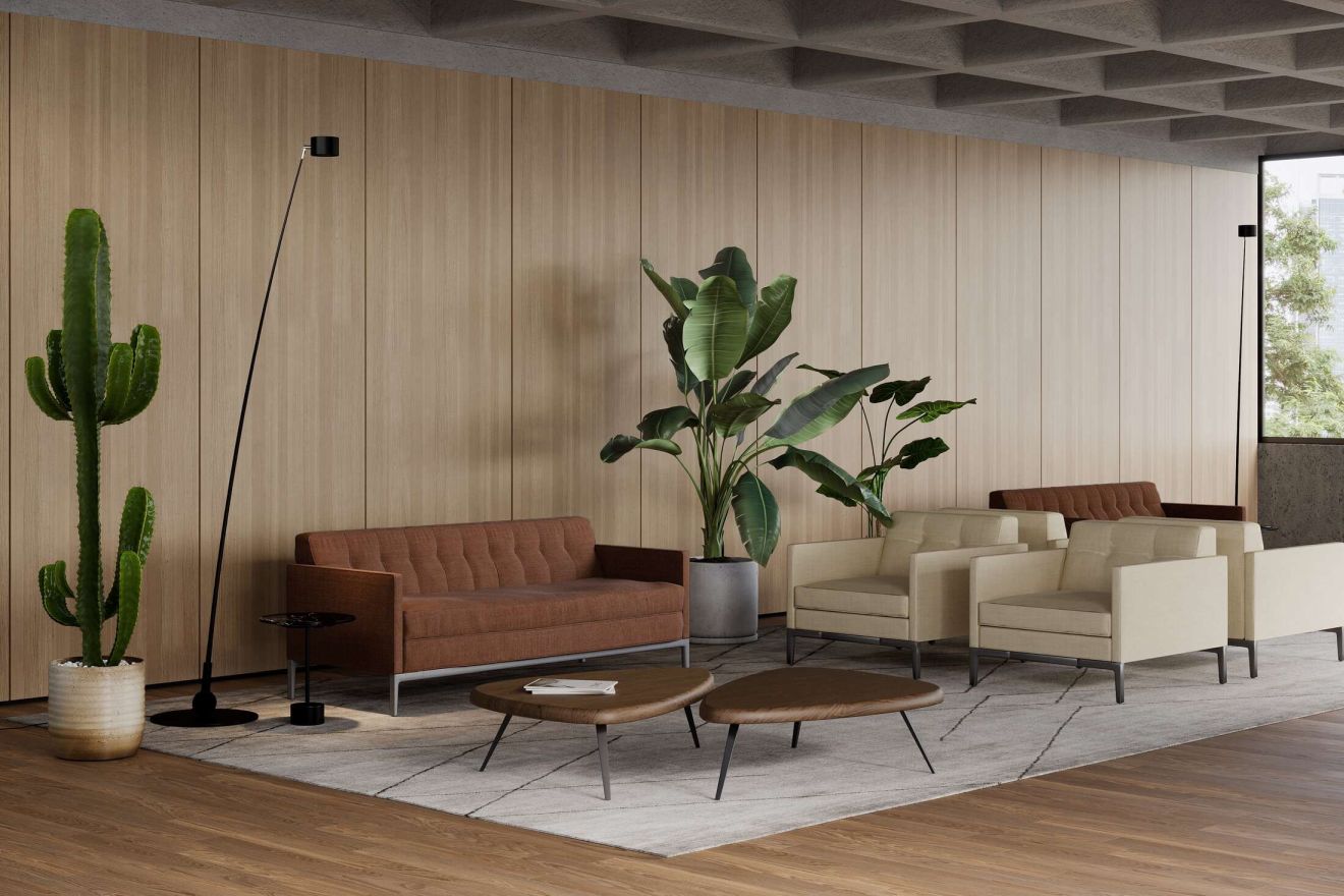 Innenaufnahme mit Cassina 194 Tisch, Sofa, Sesseln und Pflanzen in einem modernem Wohnzimmer.