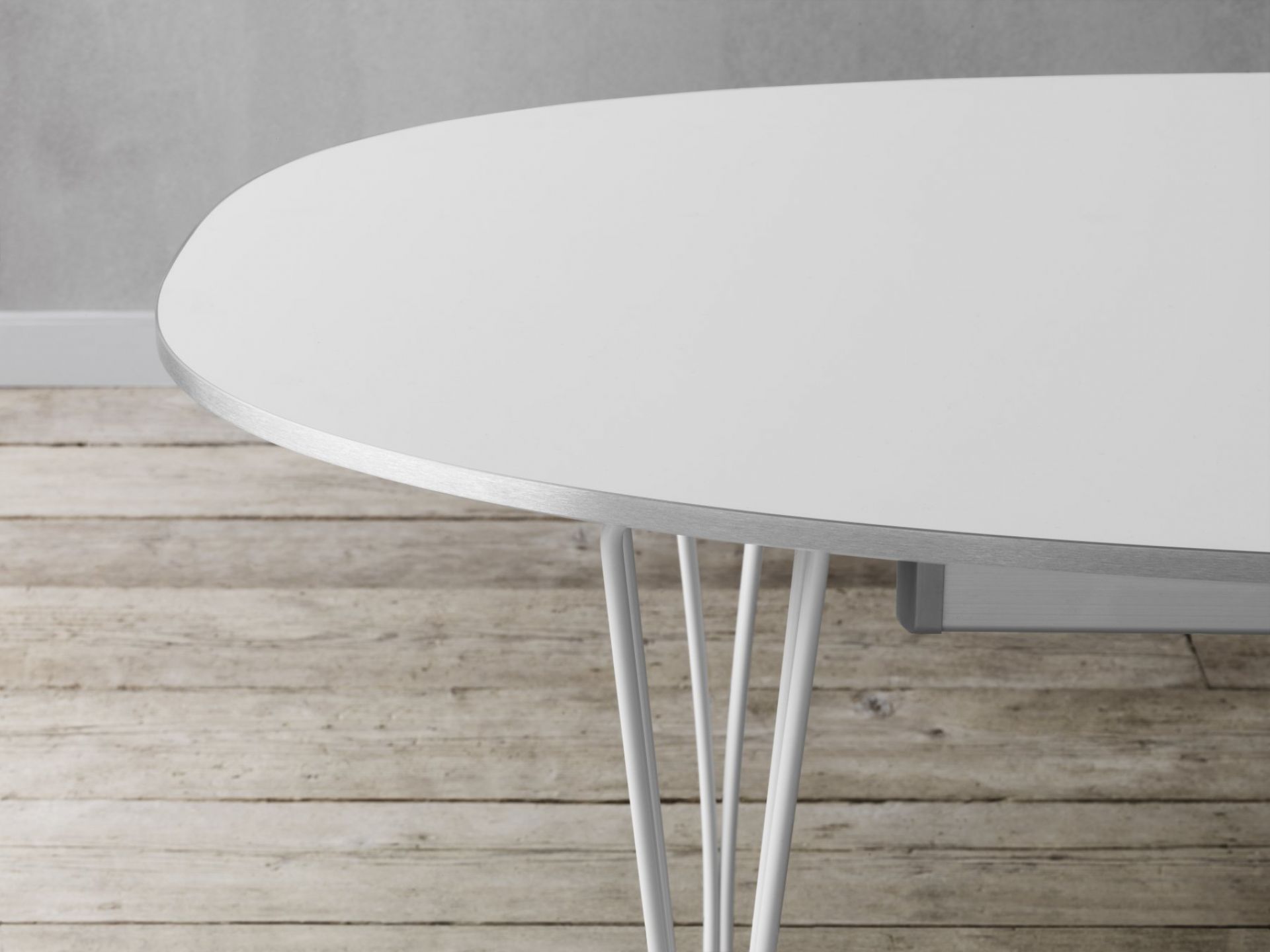 Detailaufnahme des Fritz Hansen Super Elliptisch Ausziehtisch mit weißer Tischplatte und filigranem, weißen Stahlgestell.