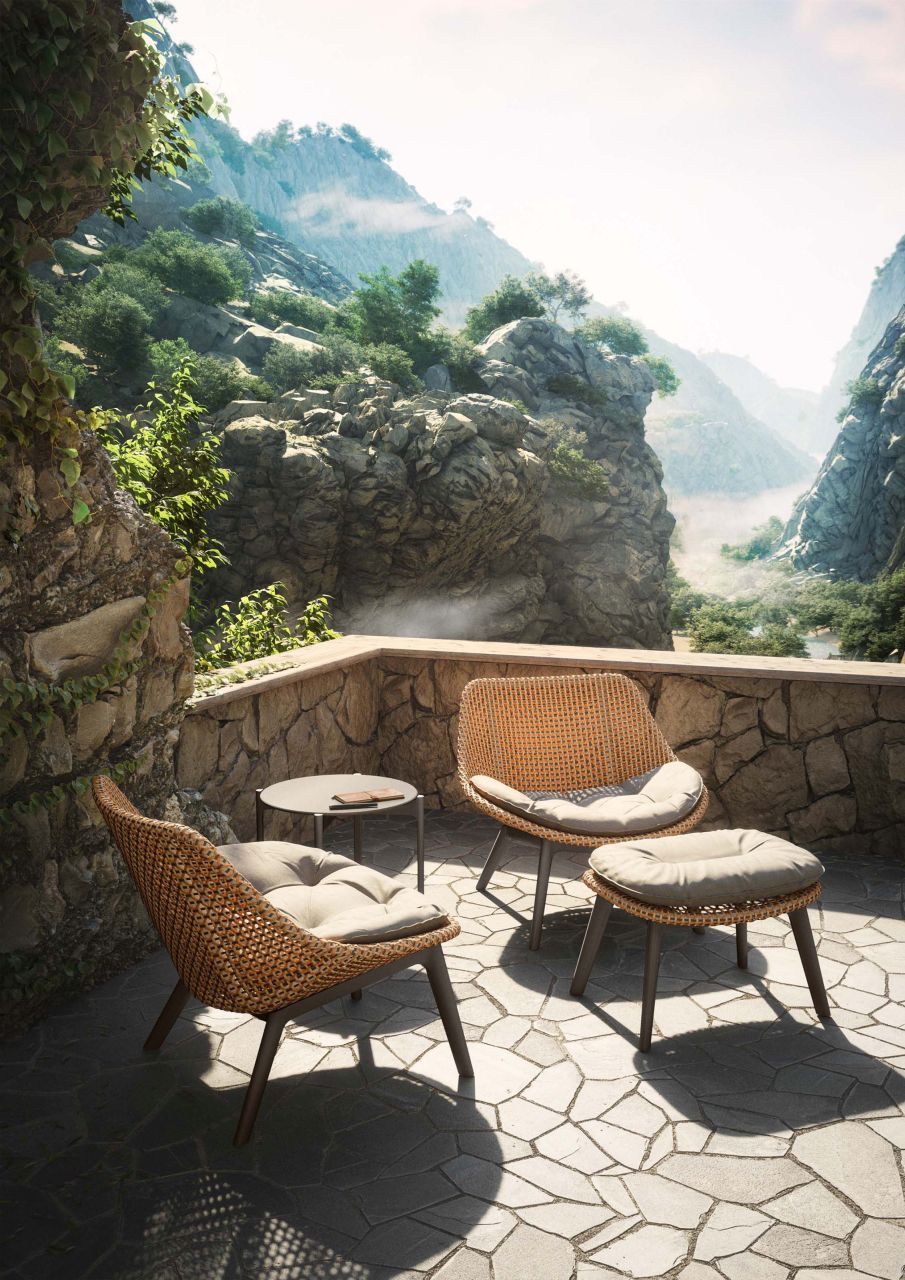 Dedon Mbrace Sessel aus Aluminium mit Sitzkissen für den Garten oder die Terrasse.