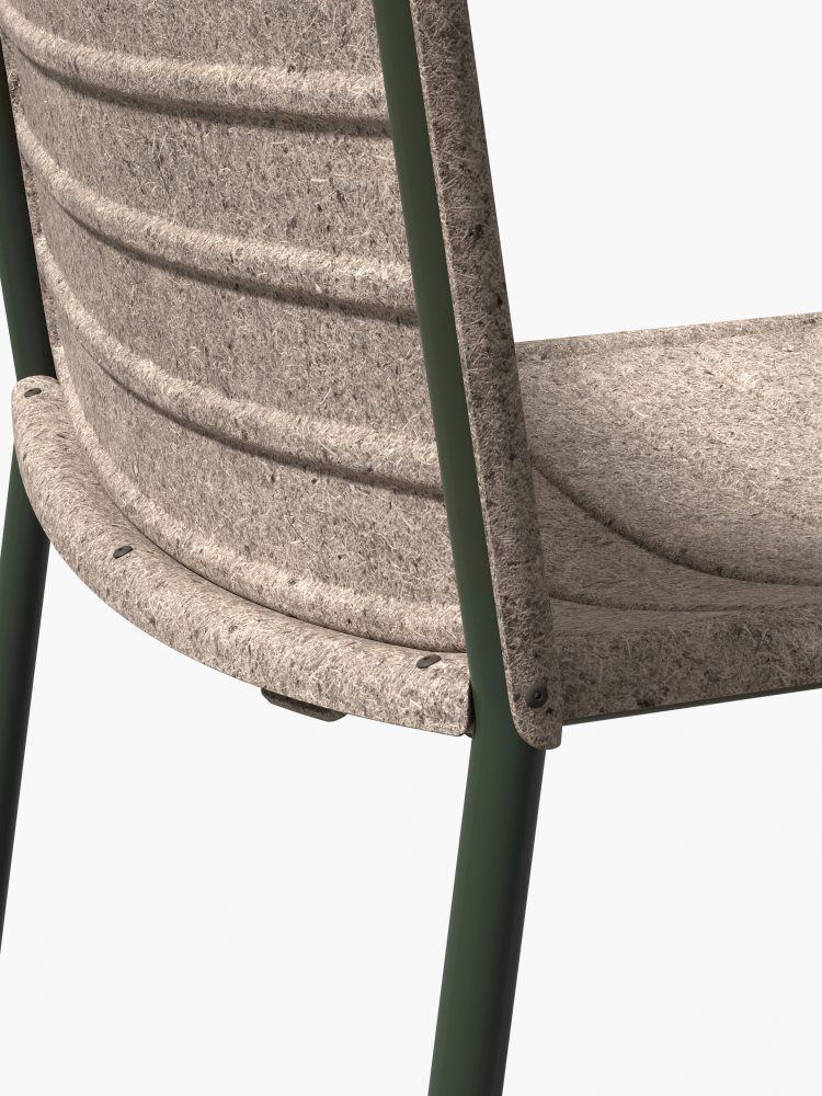 Detailaufnahme des Flax Stacker Stuhls von Please wait to be seated mit grünen Beinen.