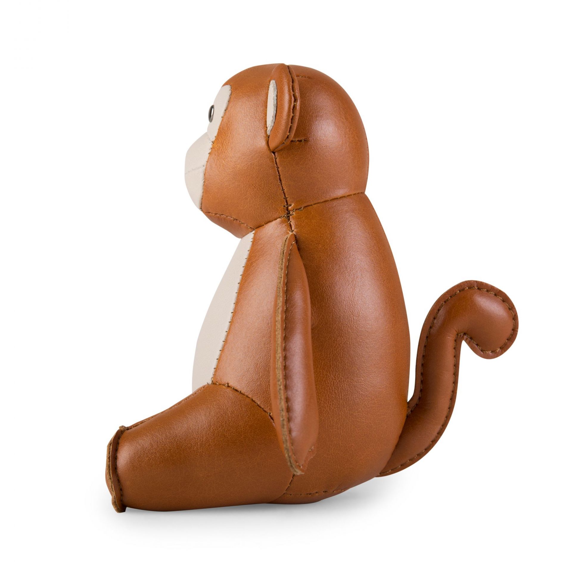 Briefbeschwerer Affe von Züny, tan und weizenfarben, aus Kunstleder, sitzend von der Seite.