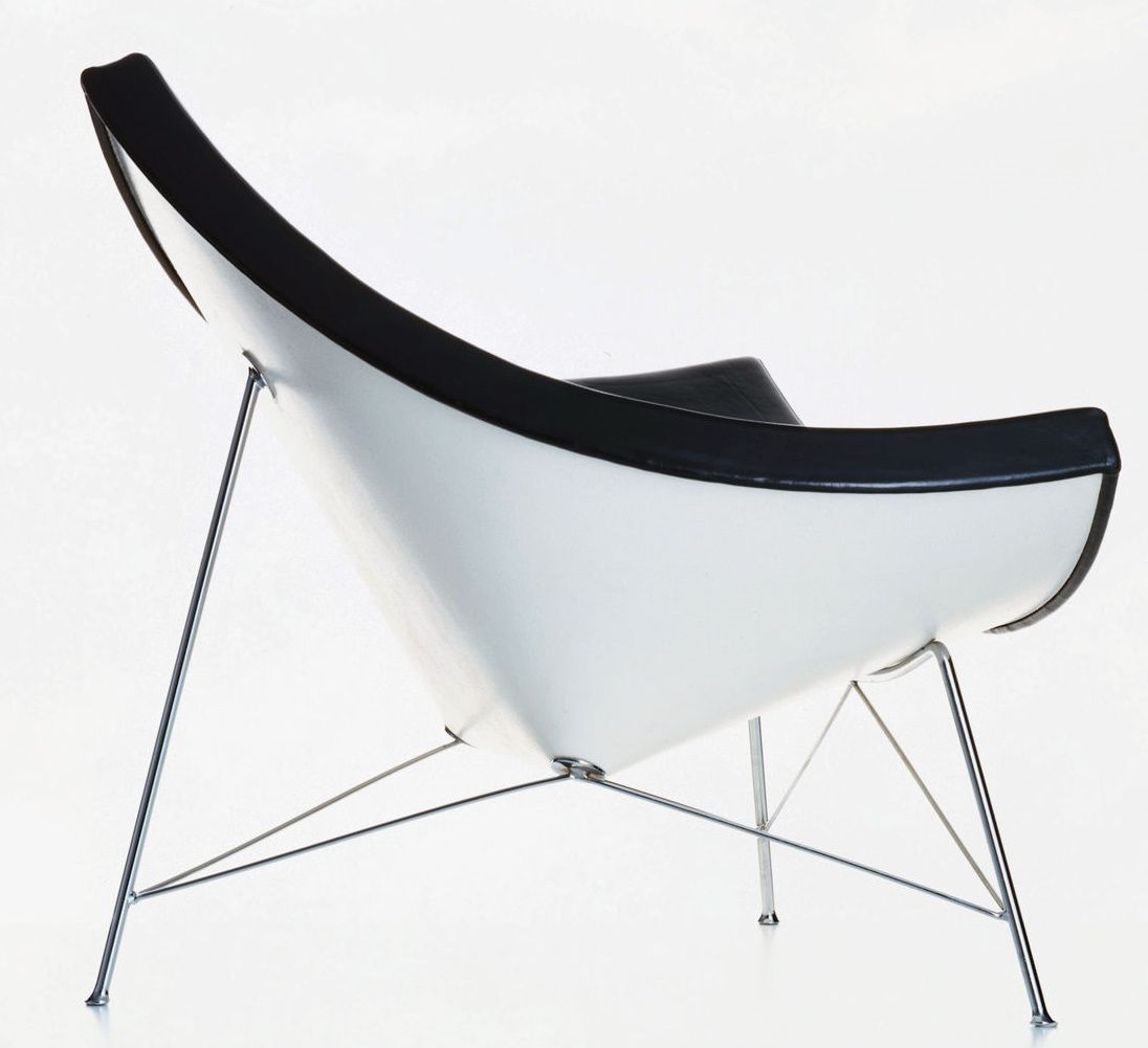 Vitra Coconut Chair in Weiß und Schwarz mit filigranem Chromgestell, seitliche Ansicht. Designklassiker für modernes Wohnen.