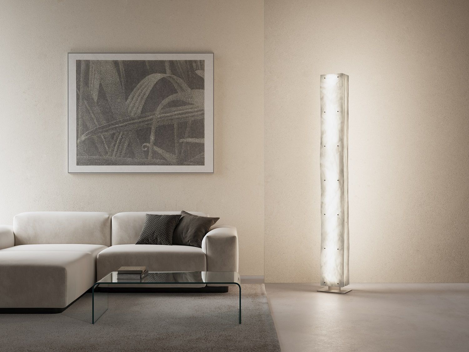 Totem Stehleuchte im Wohnzimmer: Moderne Stehlampe in Stelenform neben Sofa und Bild.