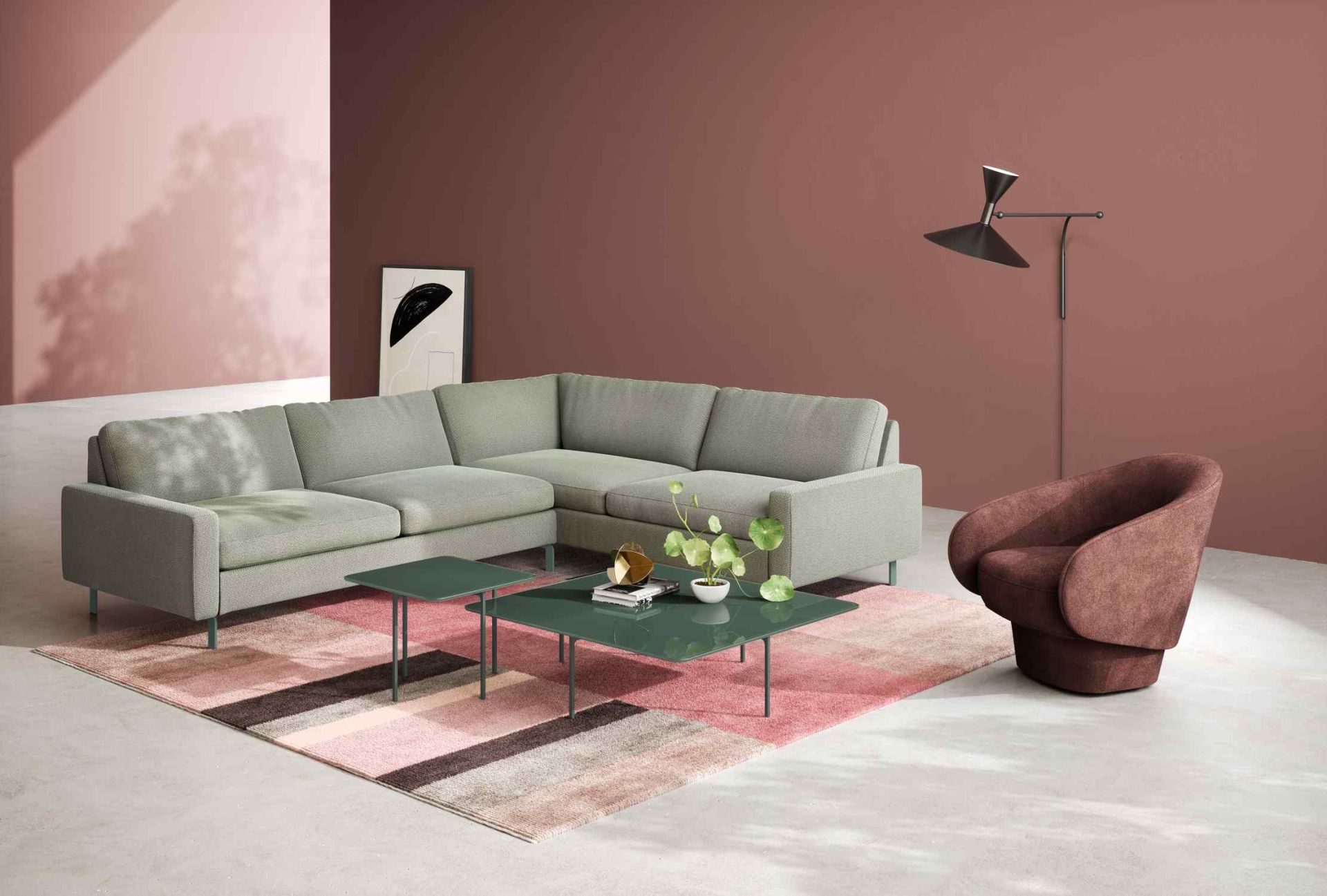 Helles Conseta Sofa von Cor in L-Form mit Couchtisch und Sessel auf gemustertem Teppich.