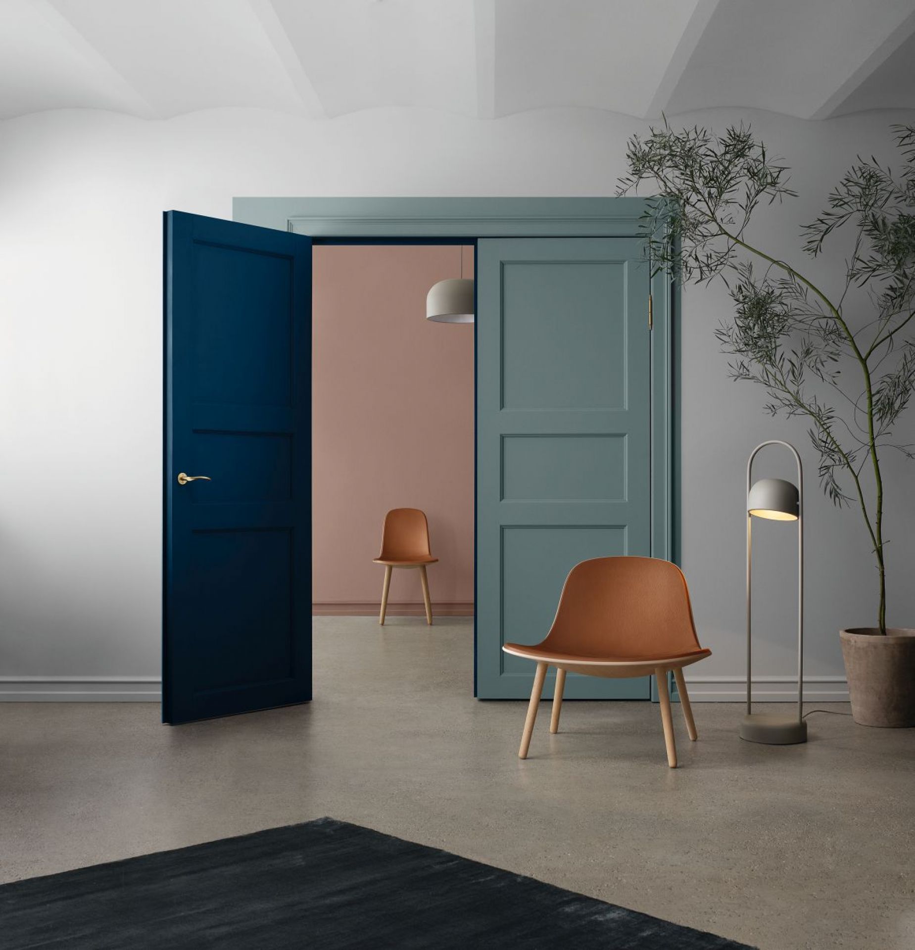 EVA SOLO ABALONE Lounge Stuhl aus Eiche, brauner Design Stuhl mit Holzbeinen im Raum.
