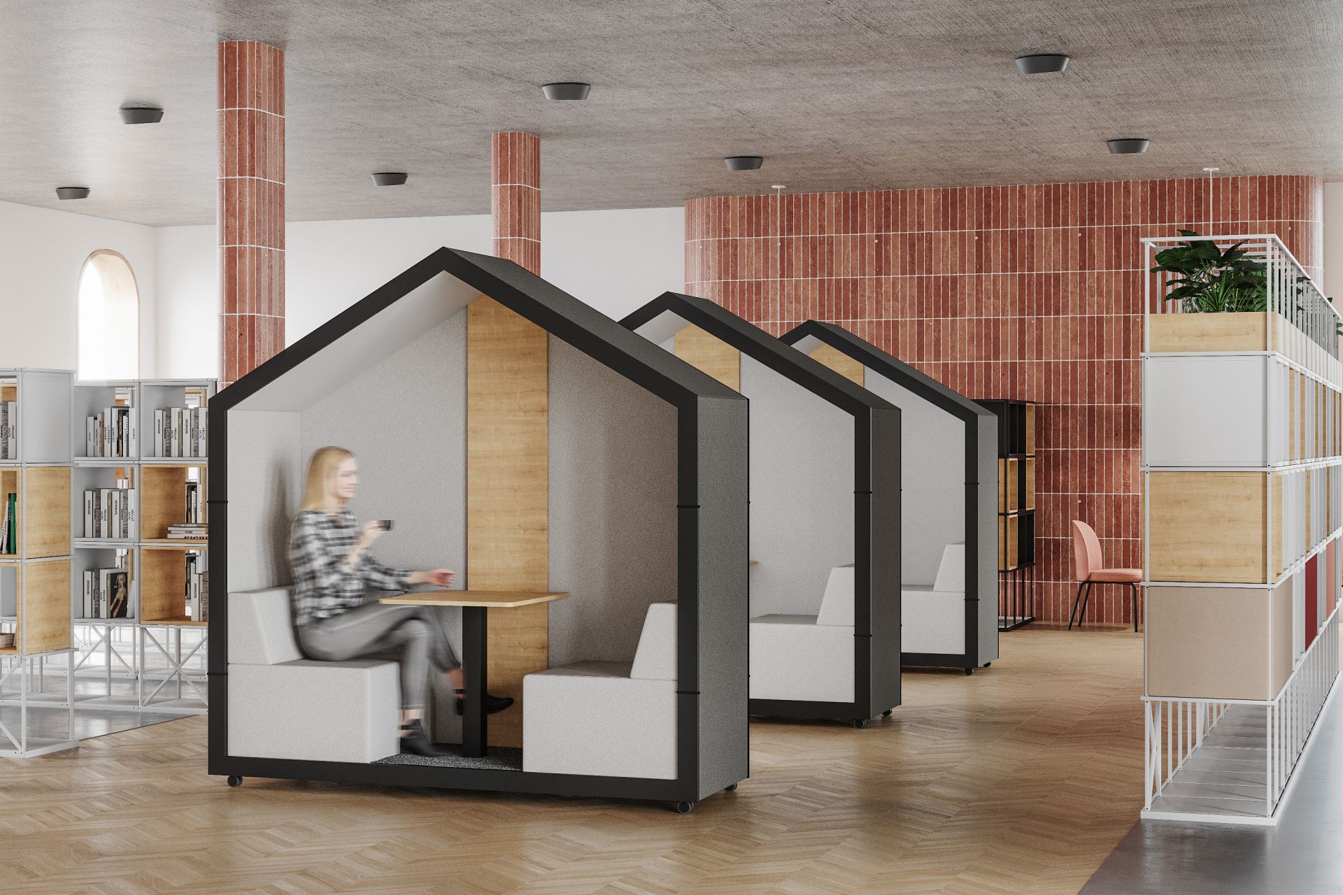 treehouse TH 2 Akustikkabine von Bejot für zwei Personen im modernen Büro, Frau sitzt entspannt darin.