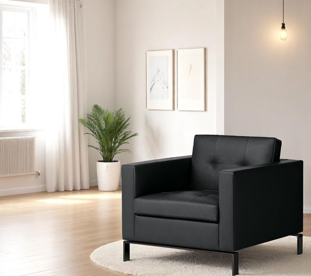 Schwarzer 502 Foster Sessel von Walter Knoll mit Lederbezug und minimalistischem Design im modernen Wohnzimmer.