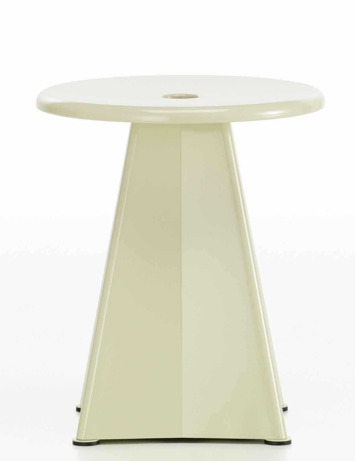 Vorderansicht des beigen Vitra Tabouret Métallique Hockers aus Metall mit runder Sitzfläche und Loch.