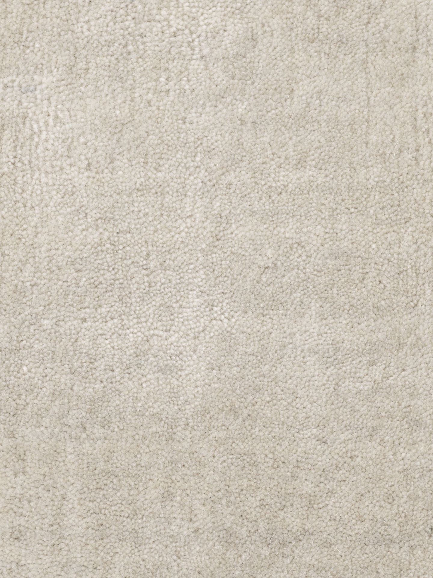 Detailaufnahme des Vipp Wollteppichs in Beige, ein luxuriöser, handgefertigter Teppich aus Wolle und Bambus.