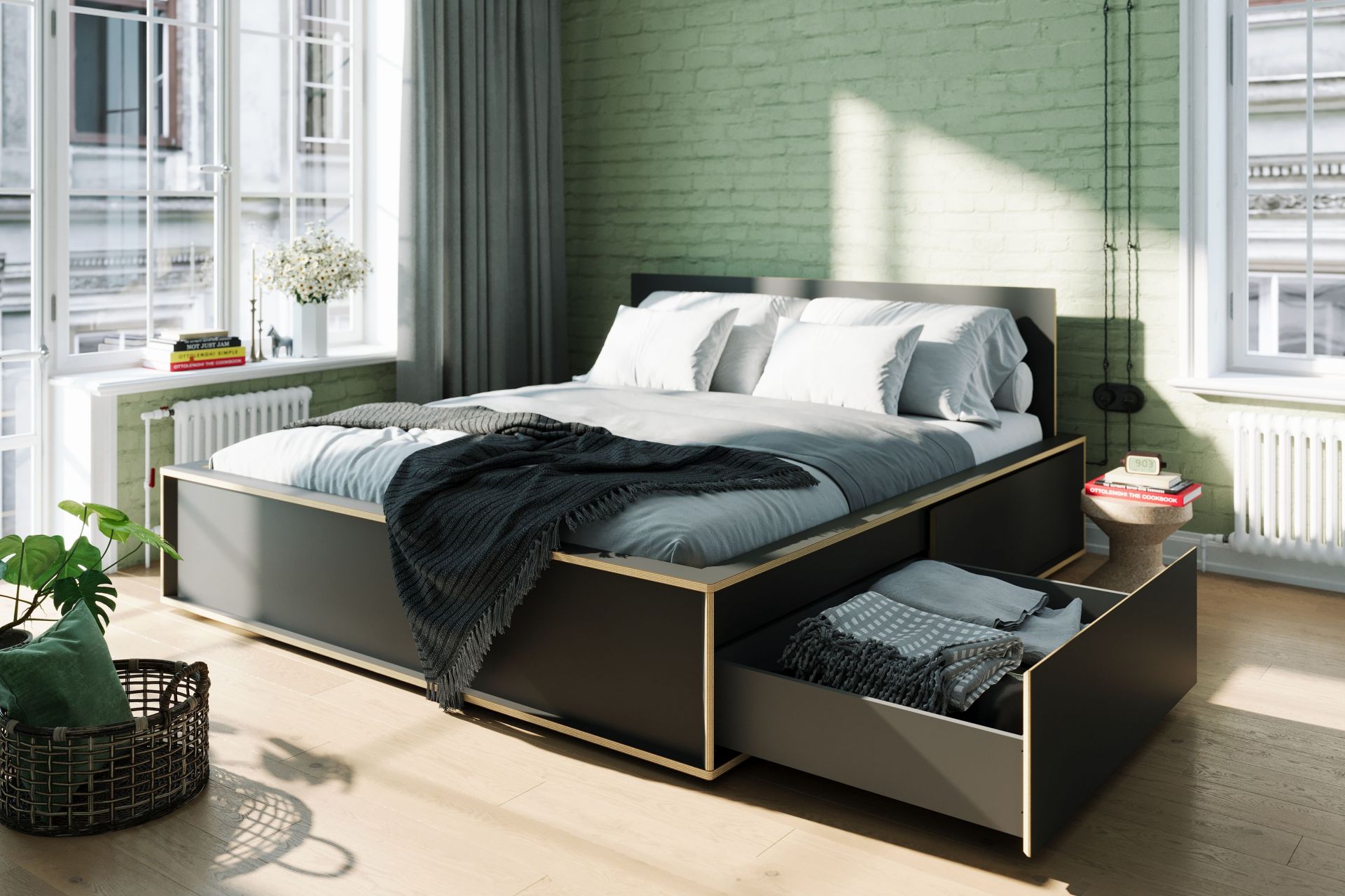 Spaze Bett von Müller Möbelwerkstätten in Grau mit Schubladen und Bettwäsche im Schlafzimmer.