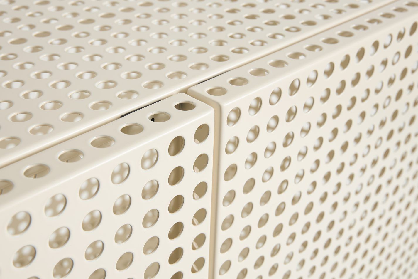 Detailaufnahme des Hay Perforated Cabinet Floor Sideboards in Beige mit Lochmuster für moderne Wohnräume.