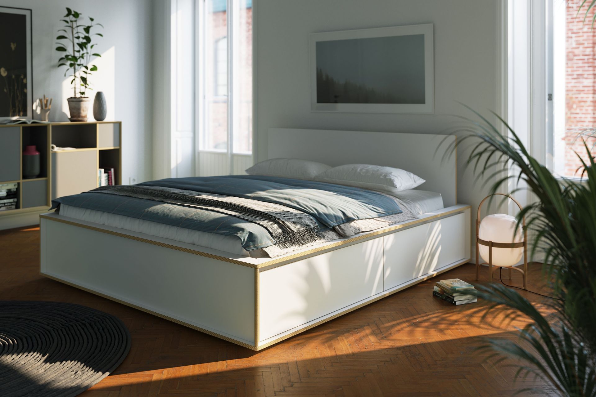 Helles Schlafzimmer mit Spaze Bett von Müller Möbelwerkstätten, blauer Bettwäsche und Holzboden für modernes Wohnen.